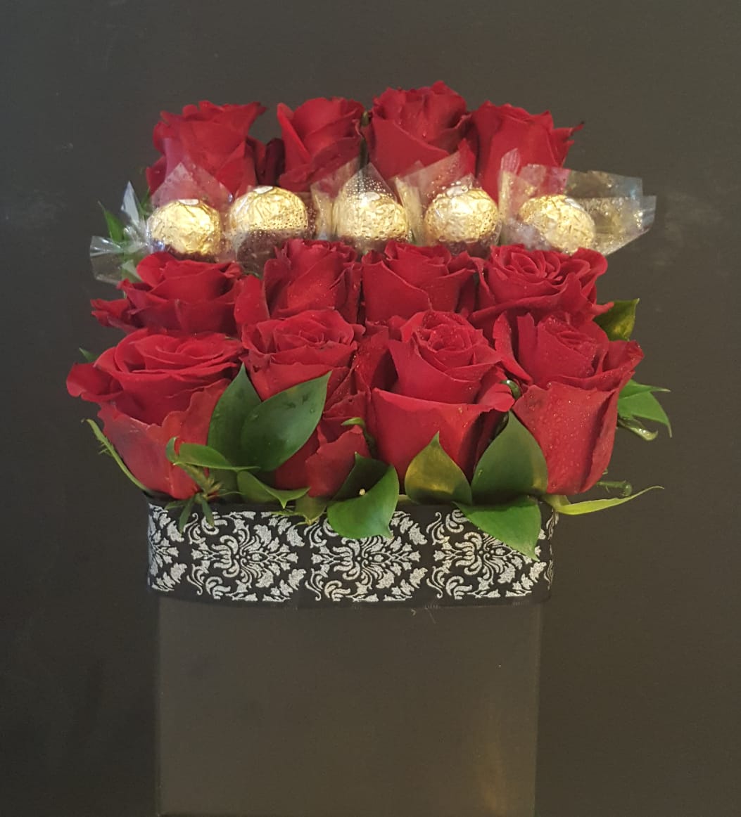 6 Roses & 3 Ferro Roche - R500 8 Roses & 4 Ferro Roche - R600 9 Roses - R550 12 Roses - R660 Includes greenery, baby breathe and elegant black box.
