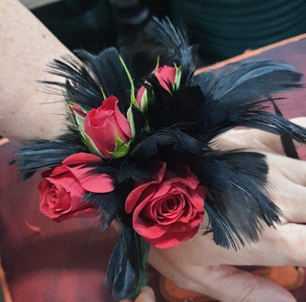 Red Feather corsage