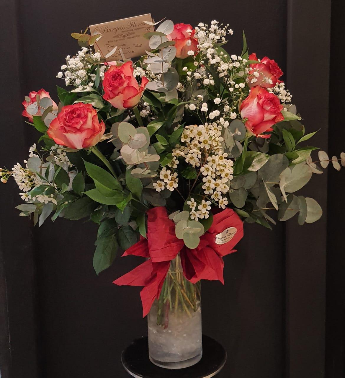 glass vases orange roses