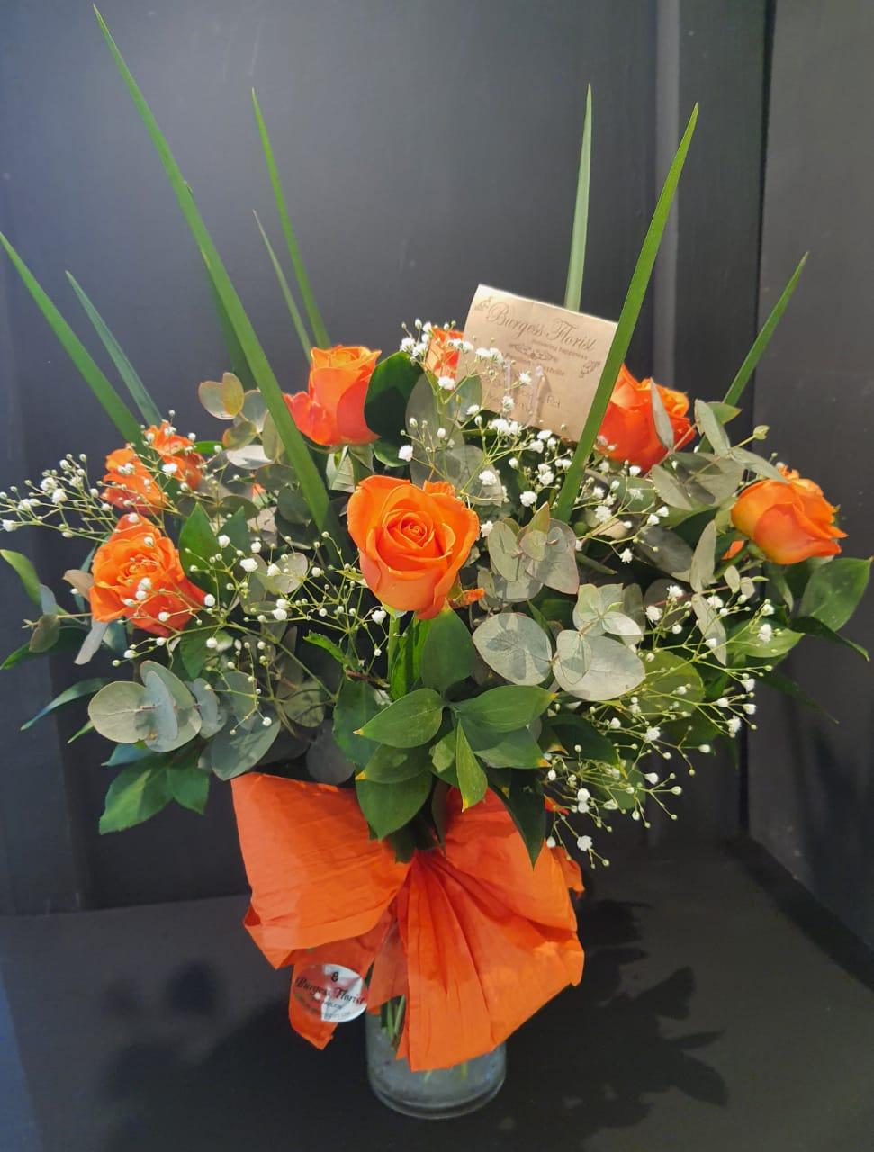 glass vases orange roses