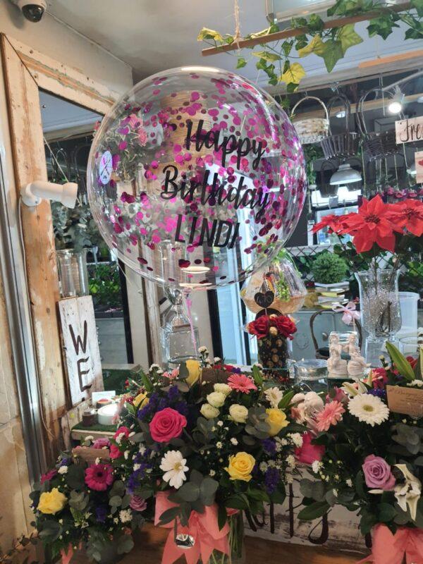 Balloons with mixed flowers